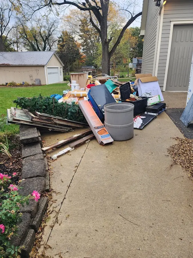 Dumpster being loaded with debris for Roofing Dumpster Rental in Pooler
